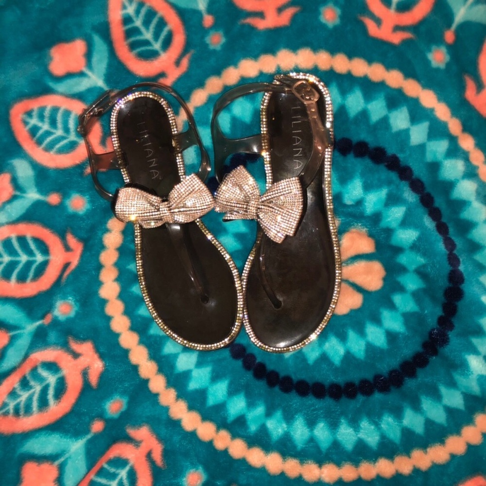 Jeweled bow flip flops